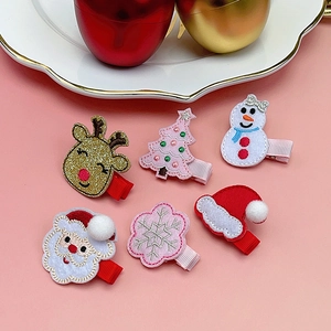 Set of 6 Christmas hair clips for kids featuring Santa, elk, and tree on pink background