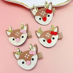 Lot de quatre barrettes de Noël cerf avec bois pailletés et jolies fleurs en tissu