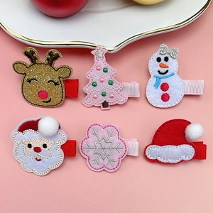 Set of 6 Christmas hair clips for kids featuring Santa, reindeer, and festive felt designs