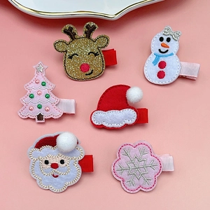 Detailed view of 6-piece Christmas hair clips featuring reindeer and Santa embroidery