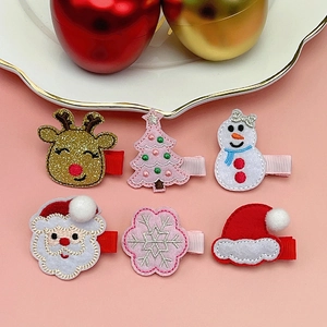 Detail of Christmas hair clips set with Santa, reindeer and snowman embroidery for kids