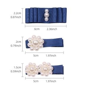Three-piece set of blue grosgrain ribbon hair clips for girls featuring white pearls