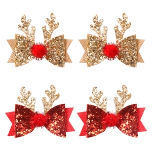 Barrettes de Noël avec bois de renne, nœuds pailletés dorés et rouges et pompons