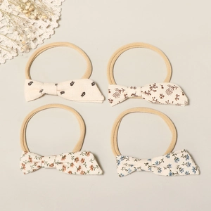 Set of 4 soft nylon baby headbands with floral cotton bows in vintage pastoral patterns