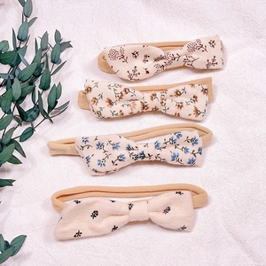 Set of four floral cotton bow headbands for baby girls on soft nylon elastic bands