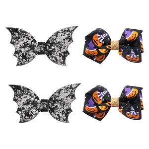 Set of 4 Halloween hair clips including bat wings and pumpkin bows with sequins