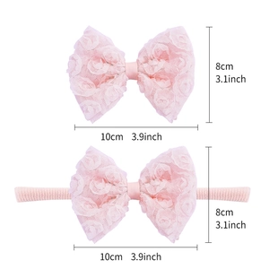 Soft pink baby lace headband set featuring delicate rose patterns and nylon bow clips