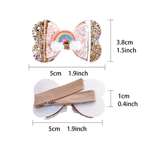Glittery gold rainbow and cloud hair clip for girls with a secure metal duckbill clamp
