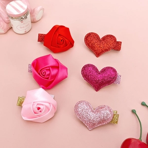 6-piece set of ribbon rose and glitter heart hair clips for girls in various shades of pink