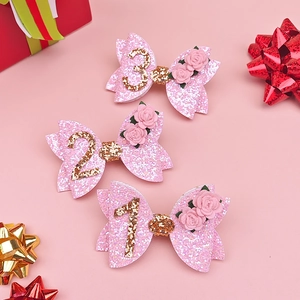 Pink glitter bow hair clips for girls birthday party with golden age numbers one to three