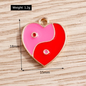 Pink and red enamel heart charm with tai chi pattern and gold metal edges detail