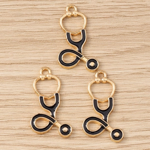 Détails de pendentifs stéthoscope en métal doré et émail noir pour la création de bijoux