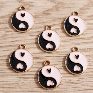 Chinese style Tai Chi heart enamel charms in black and pink with gold metal edges