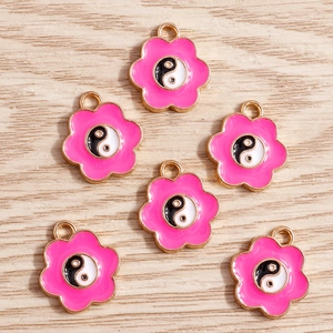 Pink enamel cherry blossom flower charms with black and white yin yang tai chi center