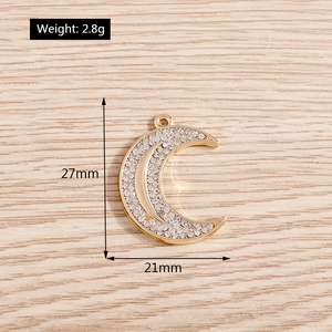 Detailed view of crescent moon alloy pendant with crystal inlay and dimension markings