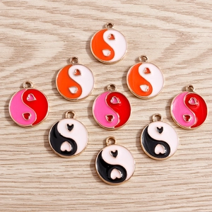 Enamel heart tai chi pendants in orange, pink, and black with golden alloy frames