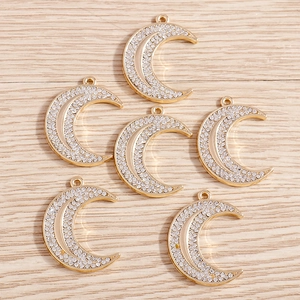 Set of six gold moon pendants with sparkling crystals for DIY jewelry making and crafts