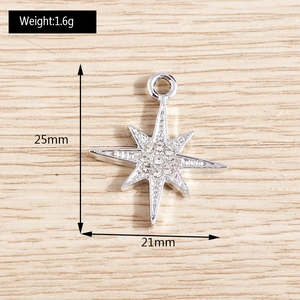 Macro view of 25mm sparkling star pendant with rhinestones and dimensions shown