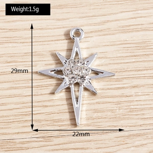 Détail d'un pendentif étoile argenté de 29x22mm avec strass et dimensions