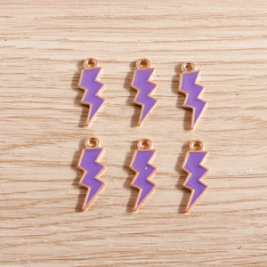 Detailed view of six purple enamel lightning bolt charms for DIY jewelry making