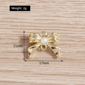 Vue détaillée du connecteur bijoux nœud 17x15mm avec perle et finition dorée