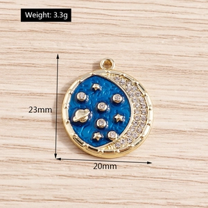 Detailed macro view of 20mm blue enamel celestial planet charm with sparkling rhinestones