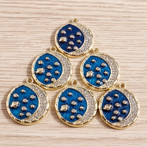 Pack of 6 gold alloy celestial pendants with blue enamel moon and planet designs