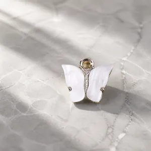 White butterfly pendant with silver metal frame and hanging ring for DIY jewelry making