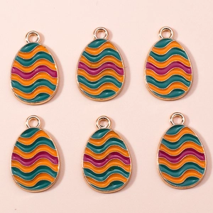 Detail view of colorful enamel Easter egg charms for DIY jewelry making and crafts