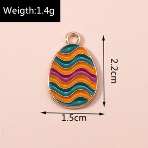 Detail of enamel wave pattern egg pendant with dimensions 1.5cm x 2.2cm and weight 1.4g