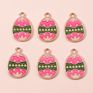 Detail of colorful Easter egg charms with floral enamel and golden alloy finish