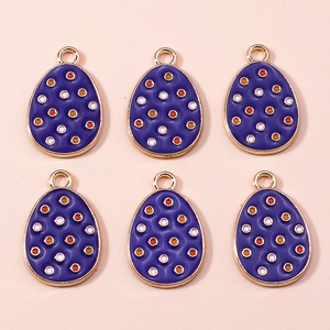 Detail of purple enamel Easter egg charms with colorful polka dots and gold metal plating