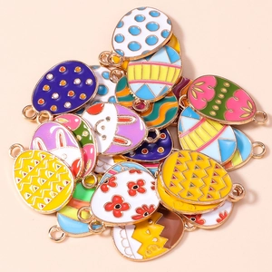 Colorful Easter egg pendants with rabbit and floral motifs for DIY jewelry making