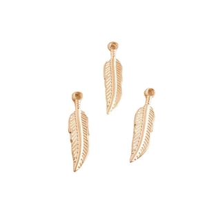 Three-piece set of gold-plated alloy feather leaf pendants with fine vein textures on white background
