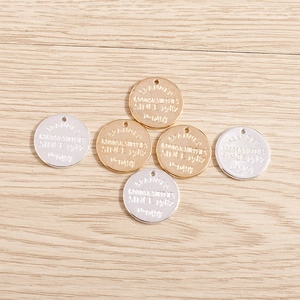 15pcs set of geometric circular metal charms in gold and silver finish on wood background