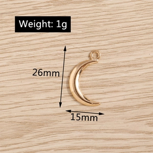 Polished gold crescent moon alloy charm pendant for DIY jewelry, 26mm x 15mm detail view