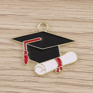 Detailed view of graduation cap and diploma enamel charm for DIY jewelry making