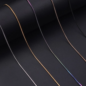 Close-up of 1.2mm snake chains in gold, silver, black and rose gold finishes