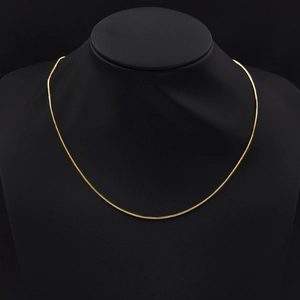 1.2mm gold-plated stainless steel snake chain necklace displayed on a black neck bust