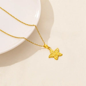 Collana a stella in acciaio inossidabile dorato con ciondolo a rilievo floreale elegante