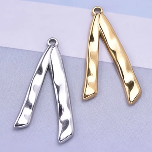 Close-up of irregular V-shaped 304 stainless steel pendants with lava texture finish