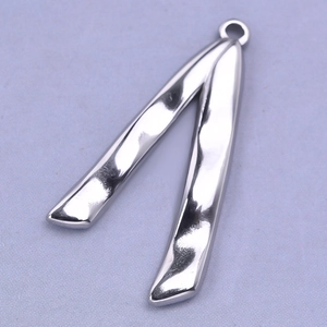 Detailed view of irregular V-shaped 304 stainless steel pendant with hammered texture finish