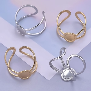 Macro shot of gold and silver stainless steel adjustable ring bases with flat round trays