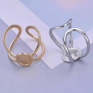 Detail view of adjustable gold and silver stainless steel ring bases for DIY jewelry