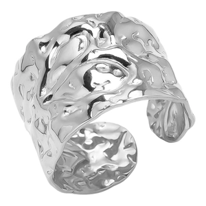 Detailed macro view of 304 stainless steel ring with unique irregular hammered texture