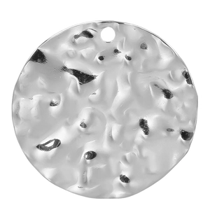 Detail of a silver hammered texture round pendant made of 304 stainless steel