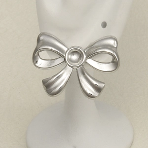 Detail view of 304 stainless steel bow knot earrings with polished silver finish