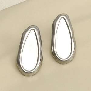 Macro view of highly polished silver irregular 304 stainless steel geometric earrings