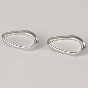 Detailed macro view of 304 stainless steel earrings with matte and polished texture