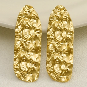 Macro detail of irregular pleated texture on 304 stainless steel long gold drop earrings